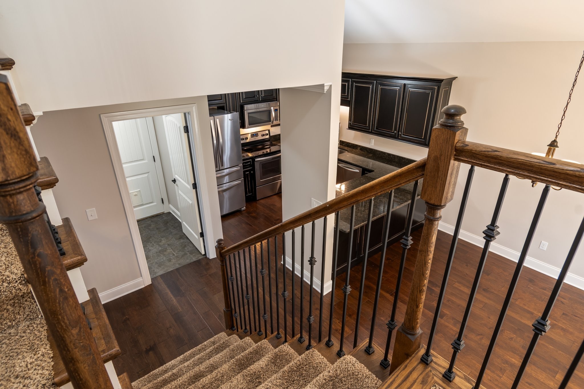 1041 Irish Way Spring Hill, TN 37174 - Photo 23 of 38 a view of staircase with white walls and railing