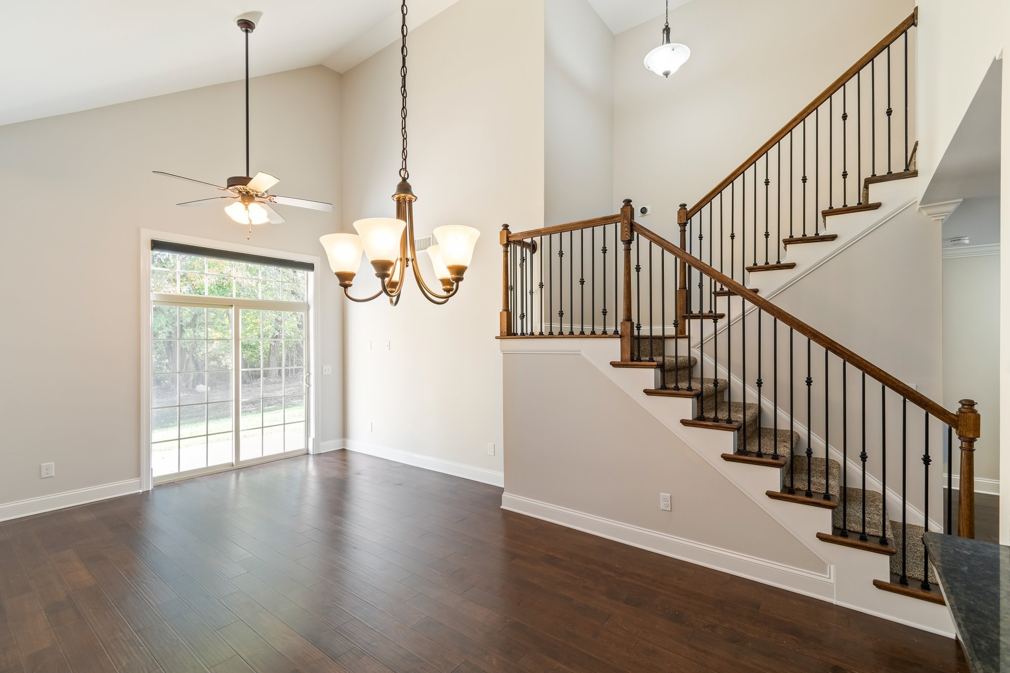 1041 Irish Way Spring Hill, TN 37174 - Photo 4 of 38 a view of a room with wooden floor windows and a chandelier
