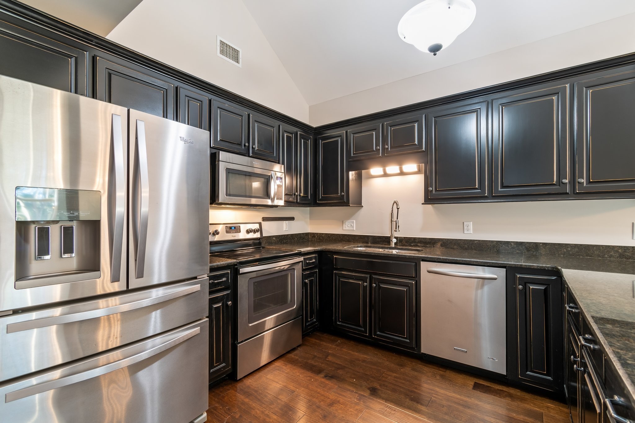 1041 Irish Way Spring Hill, TN 37174 - Photo 5 of 38 a kitchen with stainless steel appliances granite countertop a refrigerator a stove and a sink