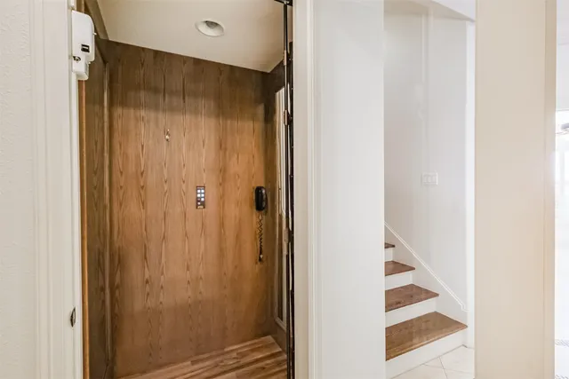 a bathroom with a shower and a sink