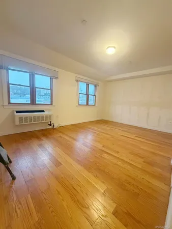 a view of an empty room with glass door
