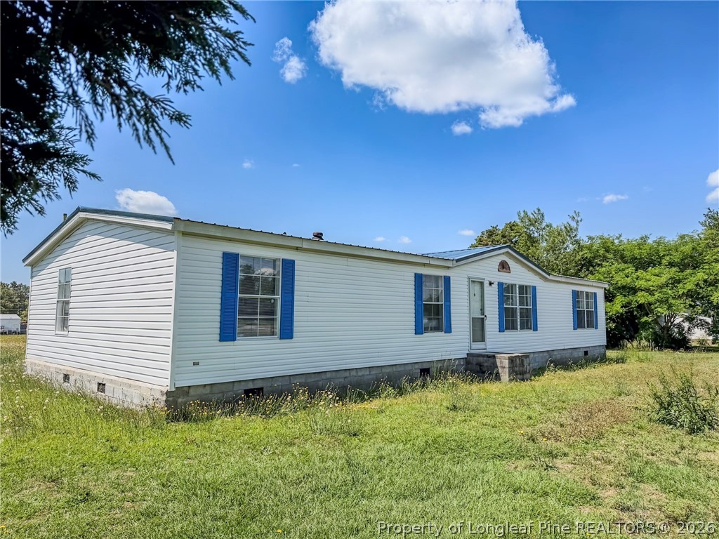 898 Brisson Road St. Pauls, NC 28384 - Photo 8 of 18 a view of a house with a backyard