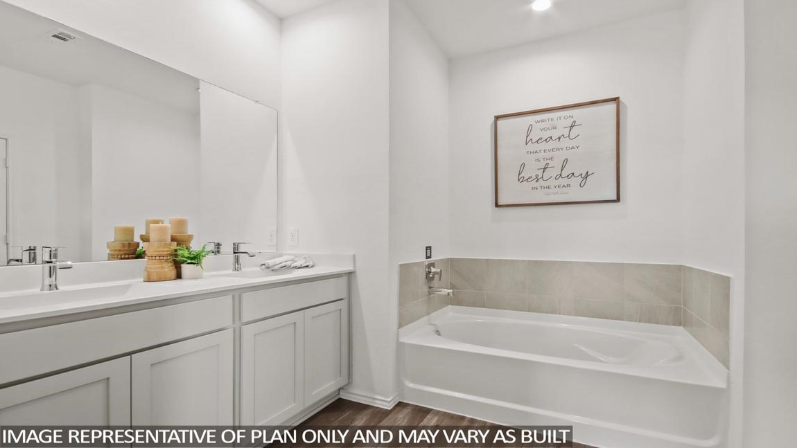 4226 Multnomah Falls Drive Conroe, TX 77303 - Photo 12 of 31 a bathroom with a tub a sink and mirror