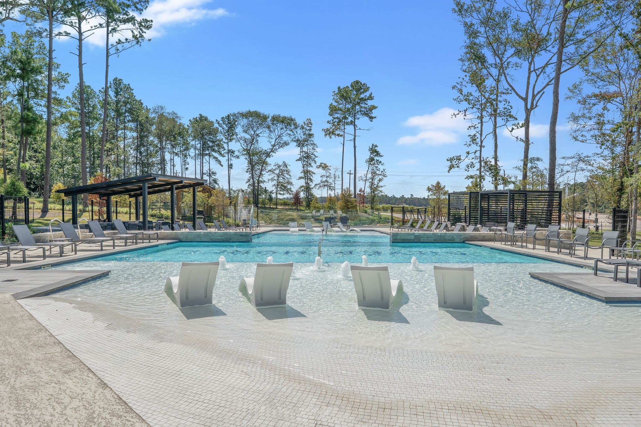 4226 Multnomah Falls Drive Conroe, TX 77303 - Photo 24 of 31 a view of a swimming pool with a patio