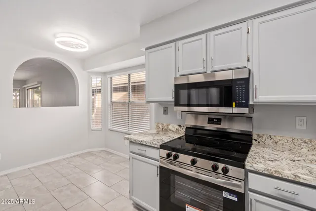a kitchen with a stove and a microwave