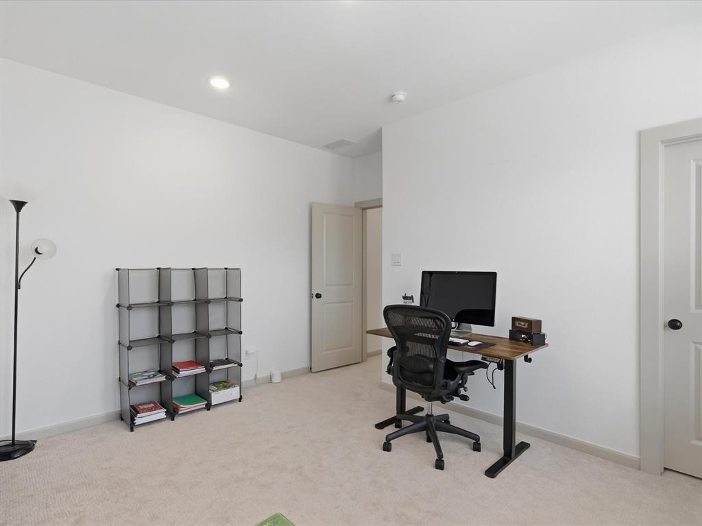 9533 Keep Street Frisco, TX 75035 - Photo 27 of 40 Neutral-toned carpeting and bright white walls provide a clean aesthetic