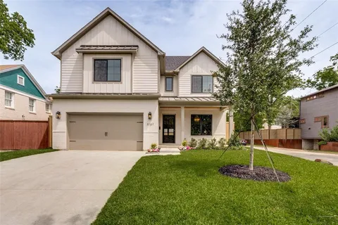 a front view of a house with a yard and porch