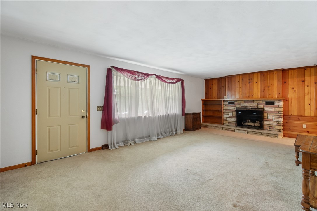 627 River Road Canal Fulton, OH 44614 - Photo 5 of 30 Living room with carpet and fireplace