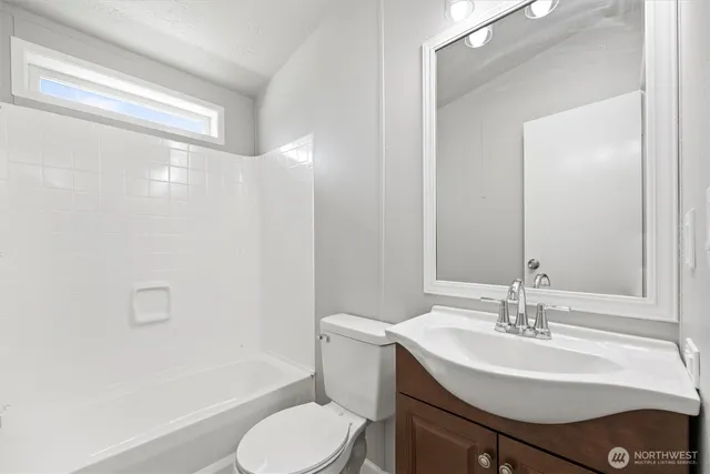 a view of a bathroom with mirror