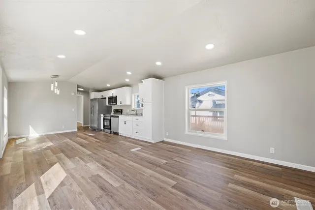 a view of a kitchen with a sink and a window