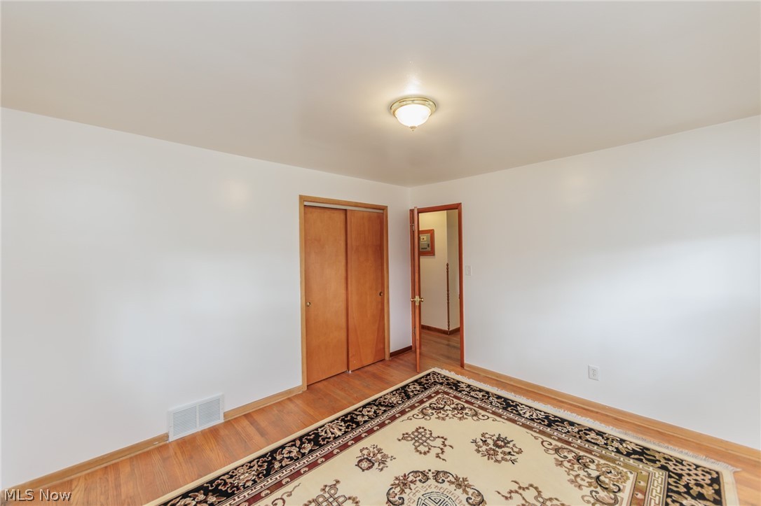 6147 Holburn Road Cleveland, OH 44129 - Photo 30 of 45 Unfurnished room with light hardwood / wood-style flooring