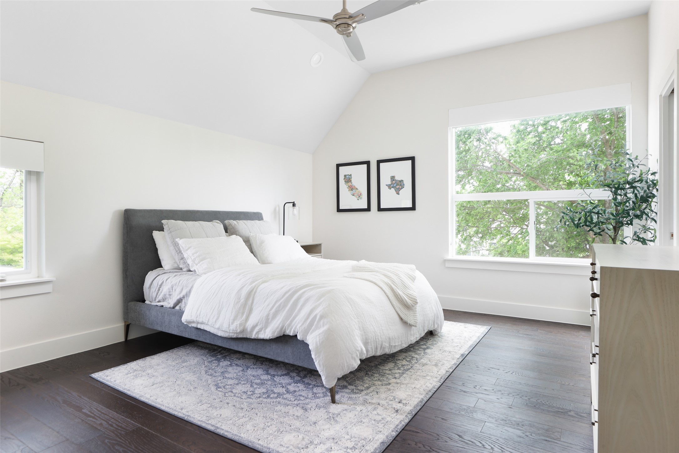 1120 Omega Avenue, Unit 1 Austin, TX 78721 - Photo 10 of 24 a bed sitting in a bedroom next to a window