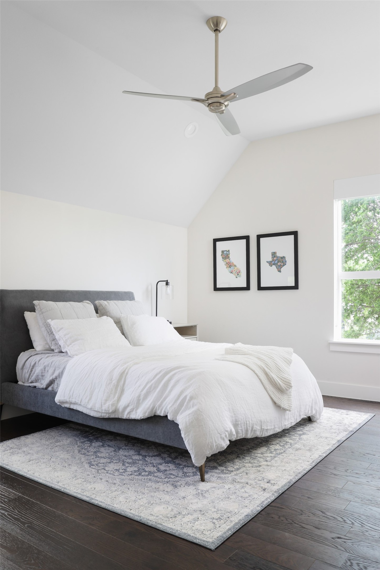 1120 Omega Avenue, Unit 1 Austin, TX 78721 - Photo 11 of 24 a bedroom with a bed and a night stand