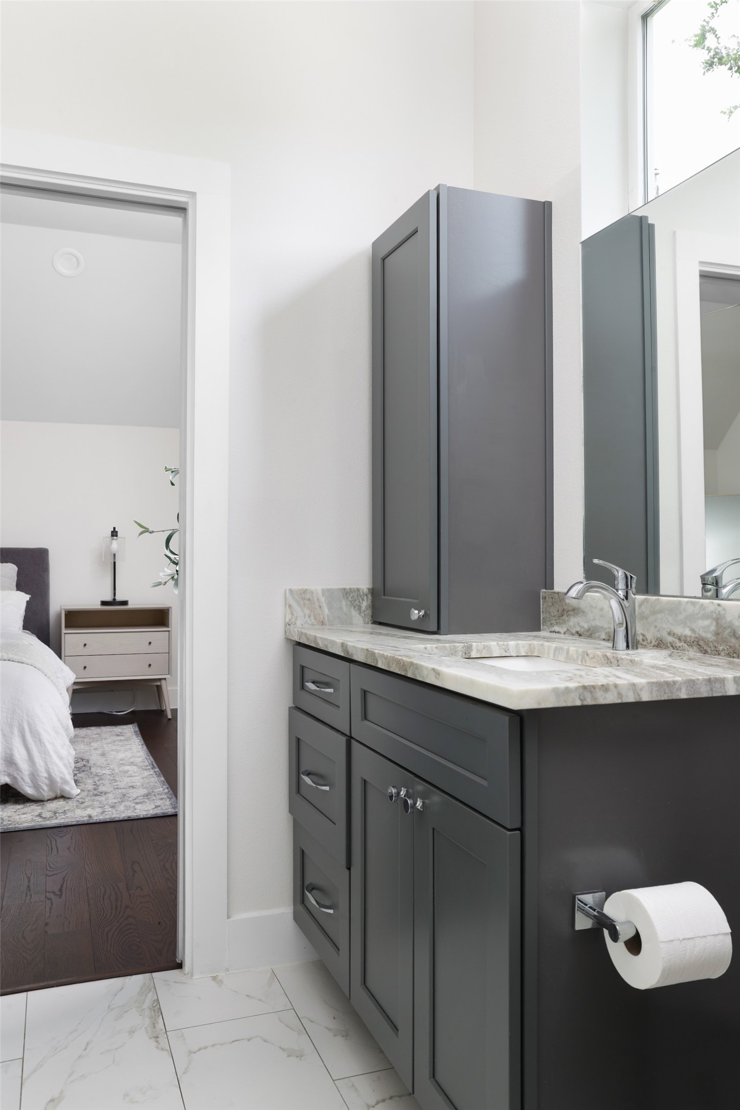 1120 Omega Avenue, Unit 1 Austin, TX 78721 - Photo 14 of 24 a bathroom with a sink and a mirror