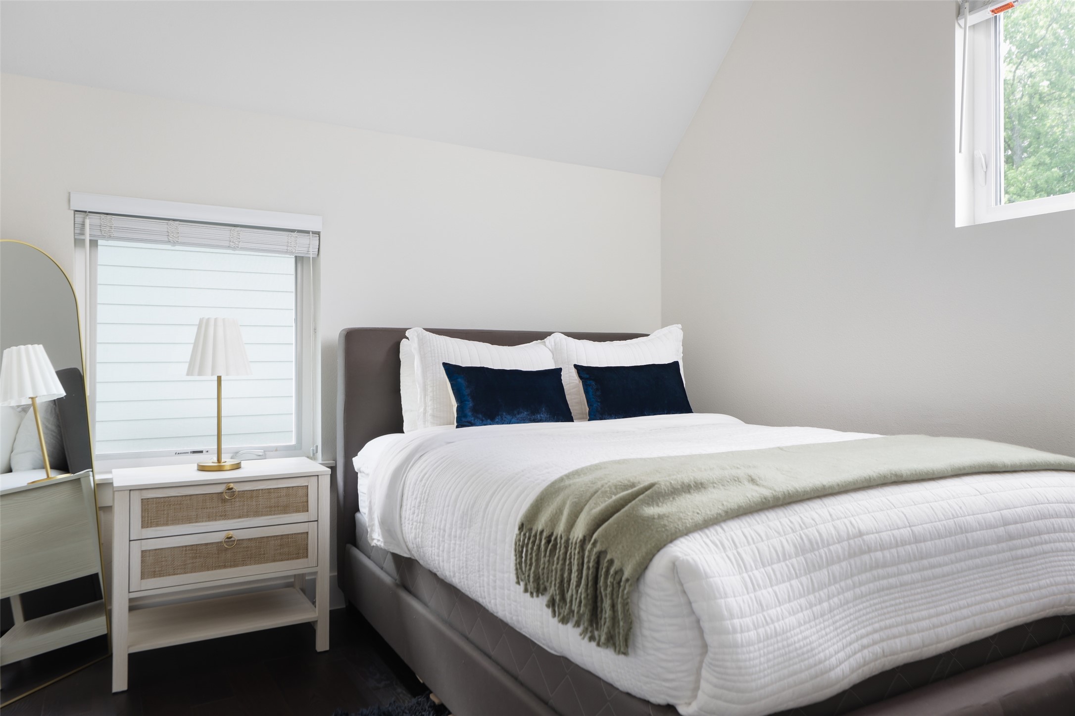 1120 Omega Avenue, Unit 1 Austin, TX 78721 - Photo 16 of 24 a bedroom with a bed and window