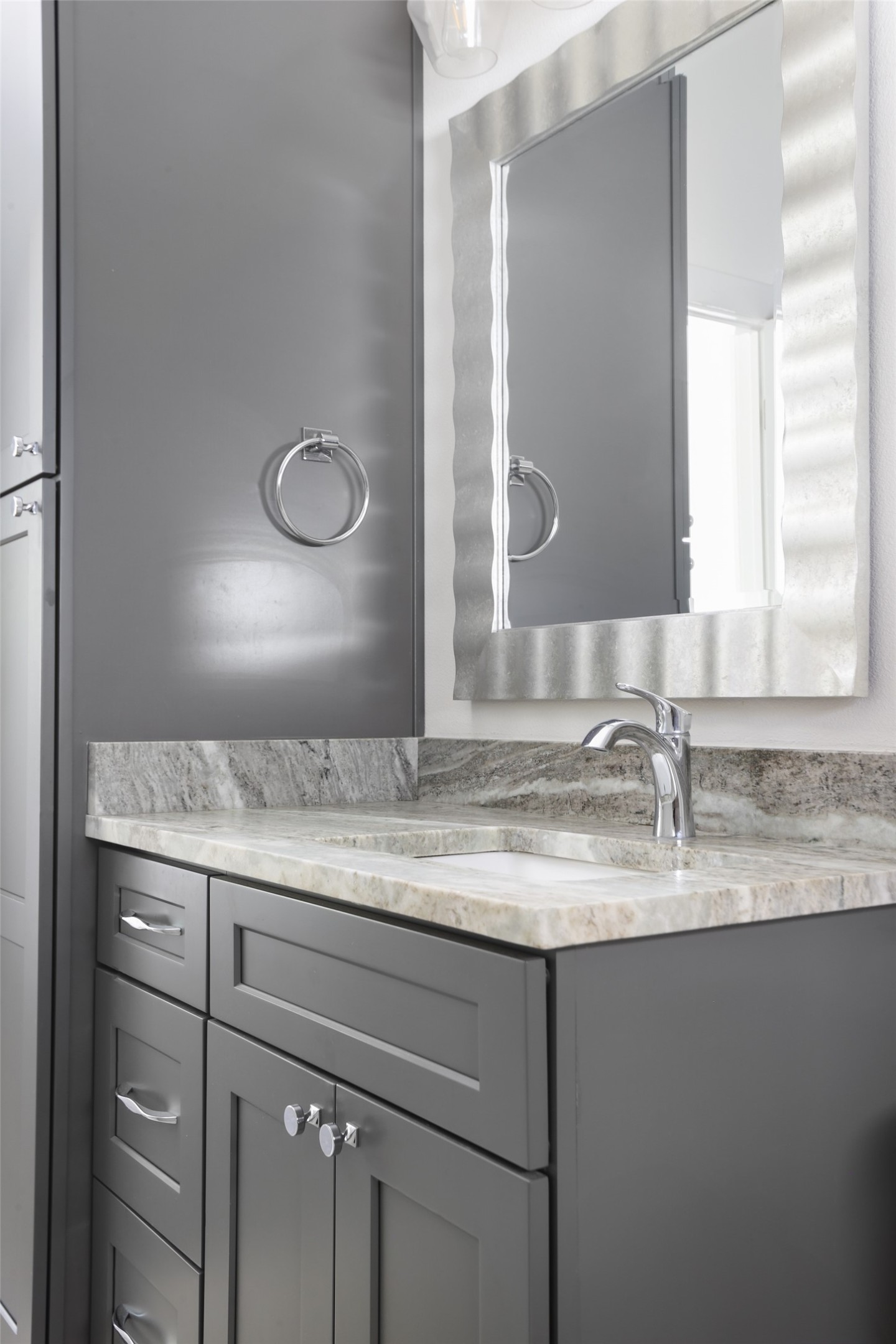 1120 Omega Avenue, Unit 1 Austin, TX 78721 - Photo 18 of 24 a bathroom with a granite countertop sink and a mirror
