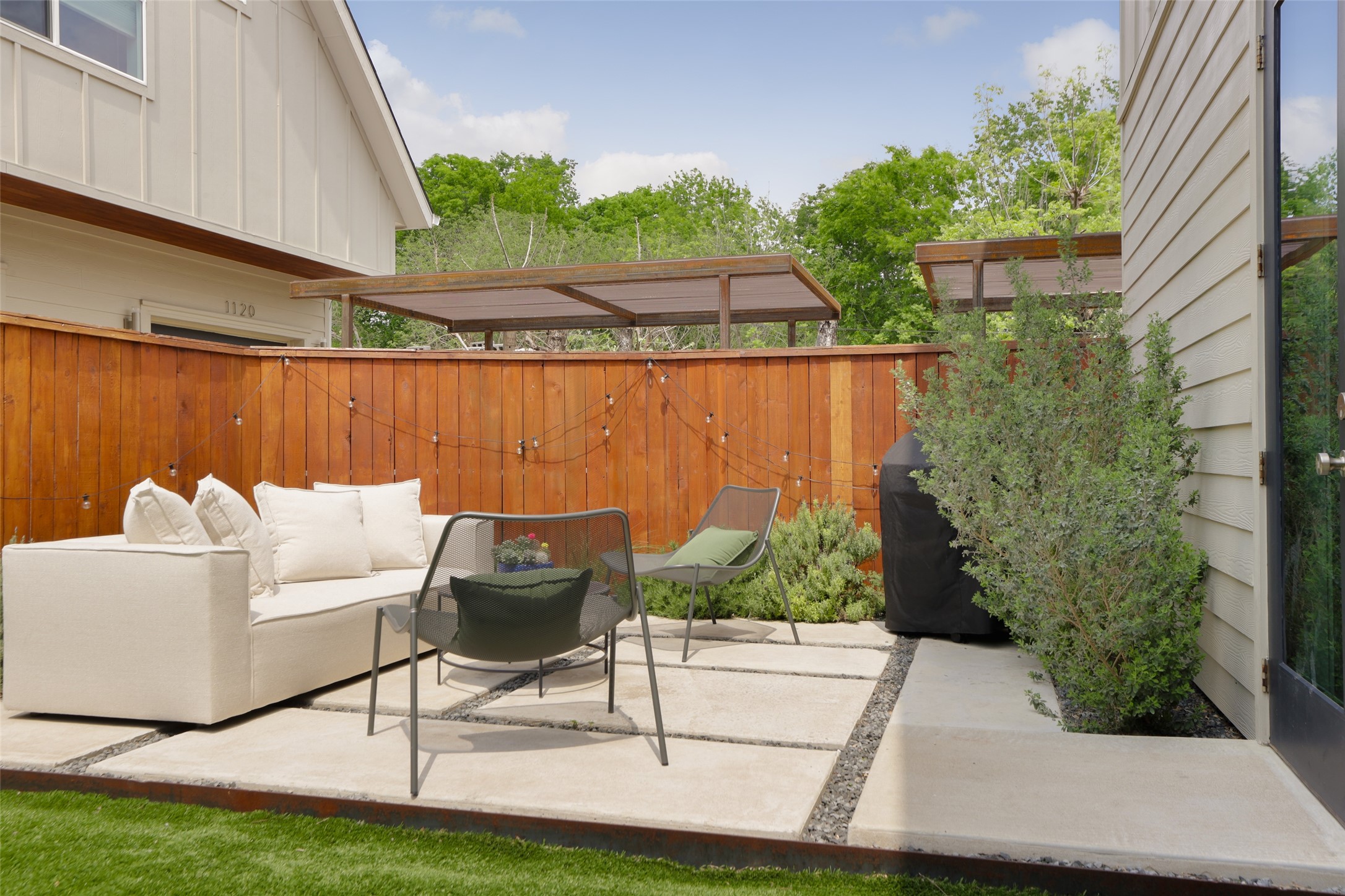 1120 Omega Avenue, Unit 1 Austin, TX 78721 - Photo 20 of 24 a view of a chairs and table in patio