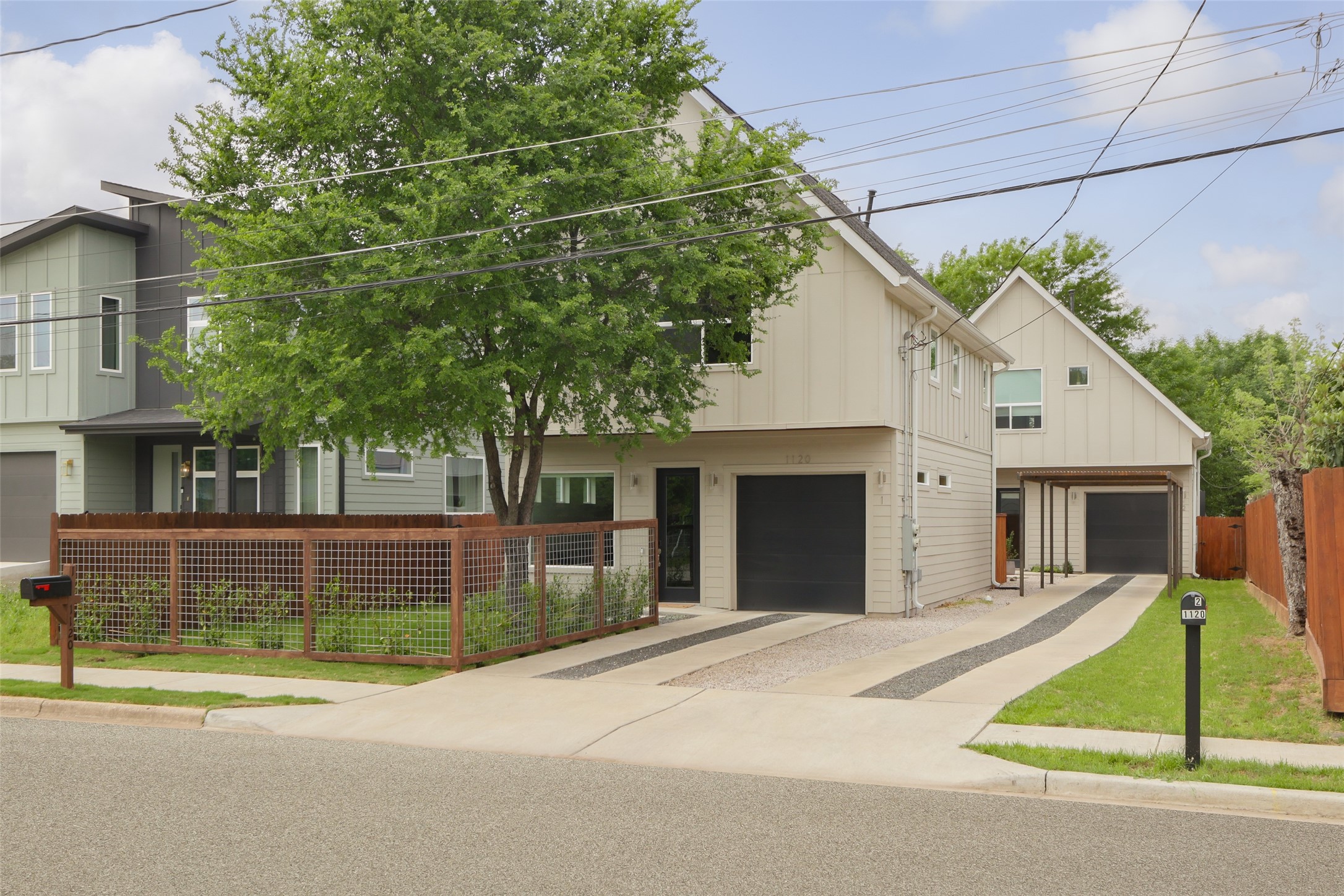 1120 Omega Avenue, Unit 1 Austin, TX 78721 - Photo 23 of 24 front view of a house with a small yard