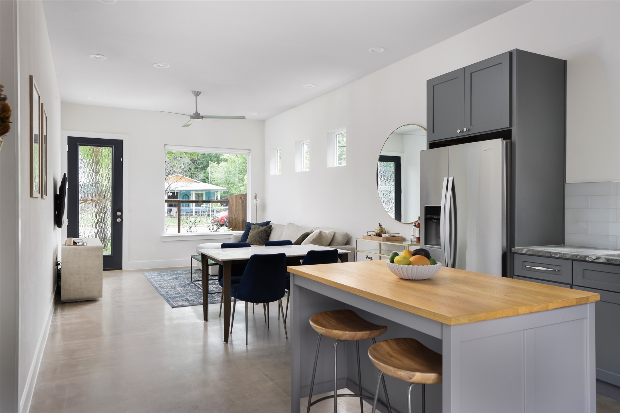 1120 Omega Avenue, Unit 1 Austin, TX 78721 - Photo 24 of 24 a kitchen with a table chairs refrigerator and window