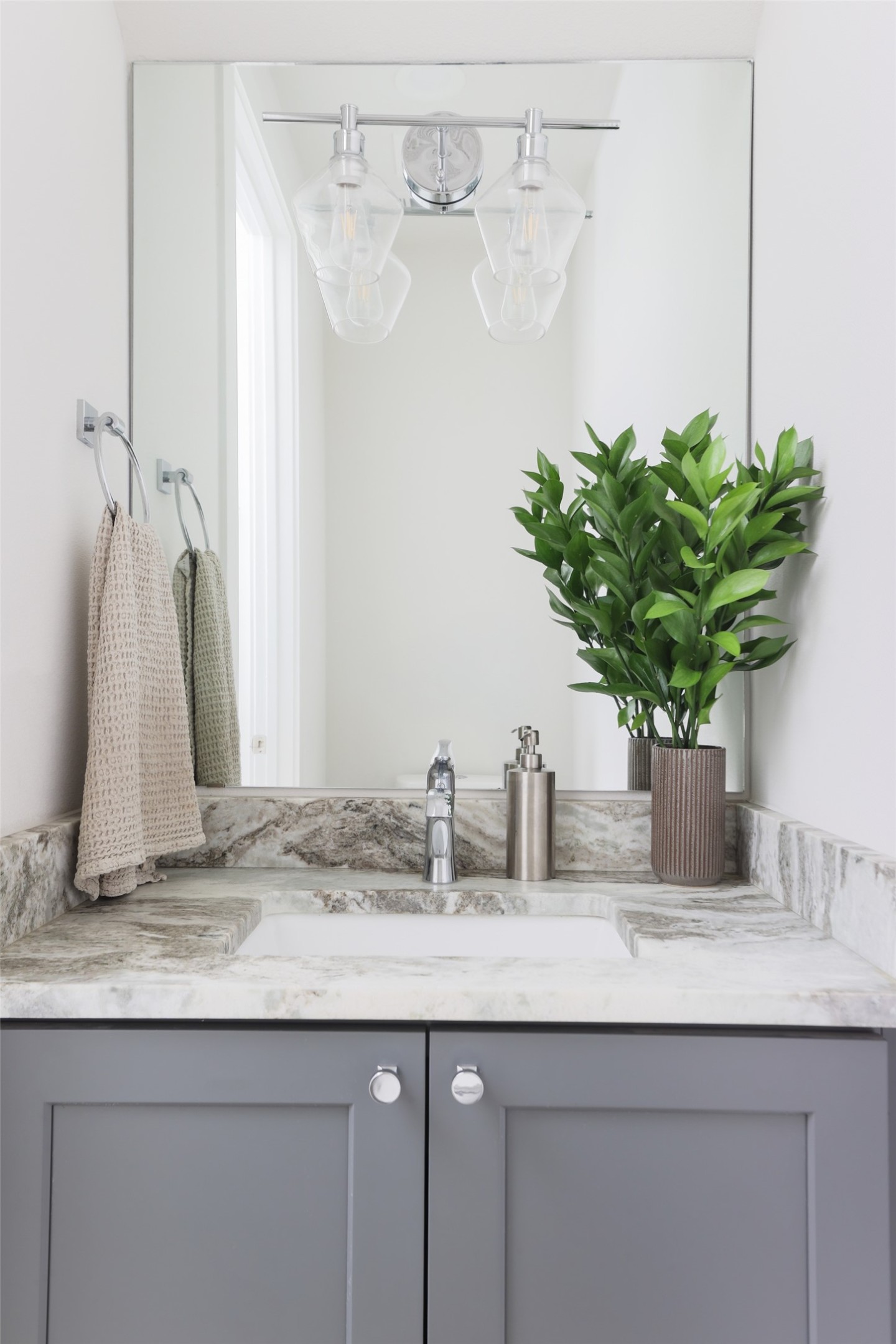 1120 Omega Avenue, Unit 1 Austin, TX 78721 - Photo 9 of 24 a bathroom sink with a granite countertop shower a sink and a mirror