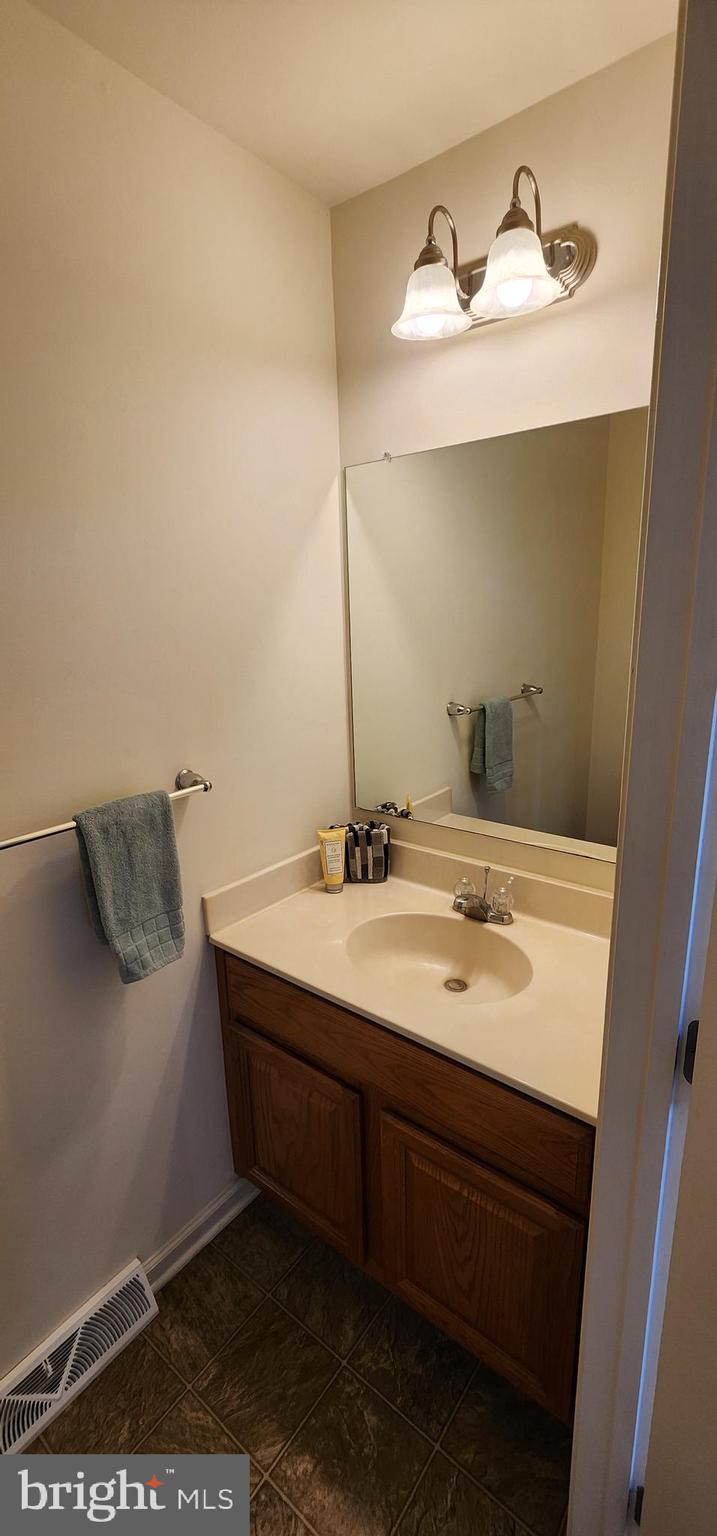 335 Paradee Drive Dover, DE 19904 - Photo 16 of 45 a bathroom with a sink and a mirror