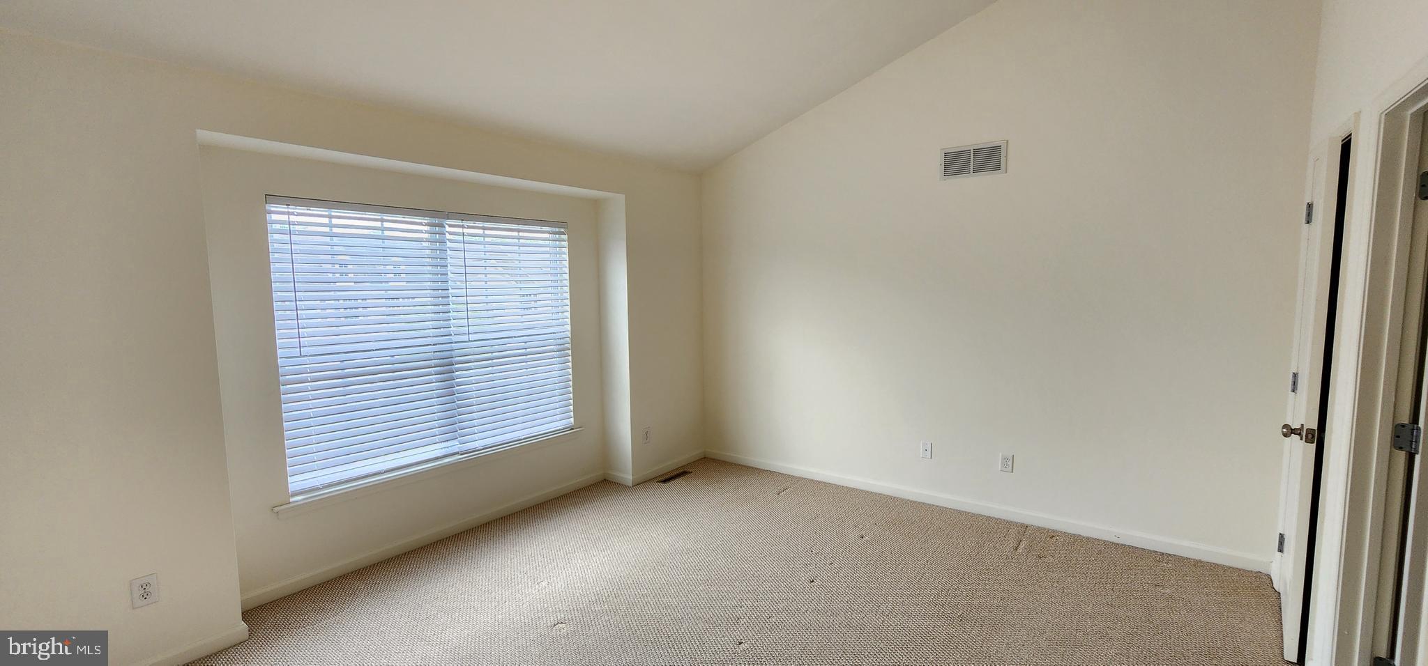 335 Paradee Drive Dover, DE 19904 - Photo 39 of 45 an empty room with windows