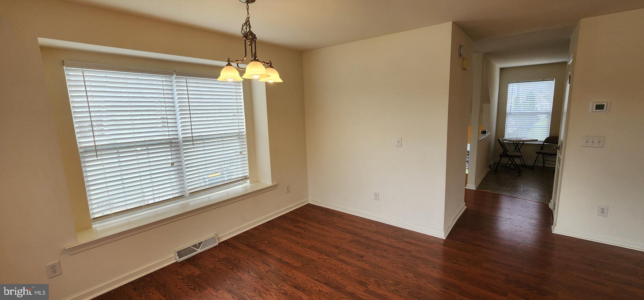 335 Paradee Drive Dover, DE 19904 - Photo 6 of 45 a view of a room with wooden floor and a window