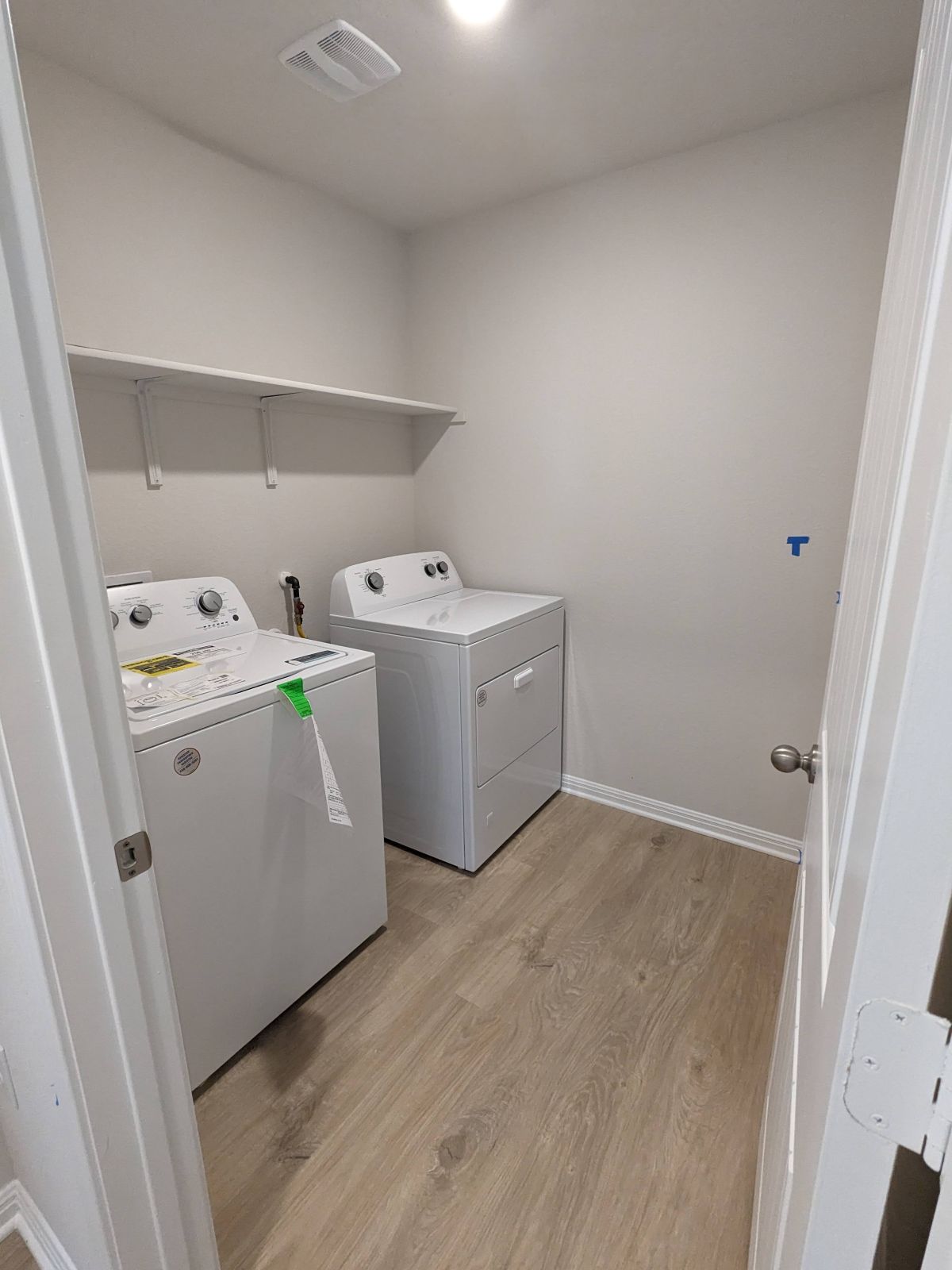 2412 Lightning View Leander, TX 78641 - Photo 12 of 24 Functional utility space featuring convenient appliance hookups and durable flooring.