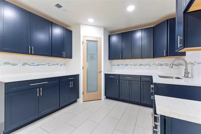 a bathroom with a sink double vanity and a mirror