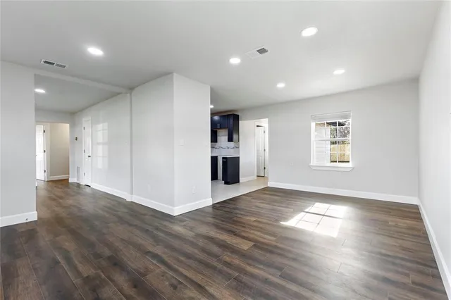 a kitchen with a sink and wooden cabinets