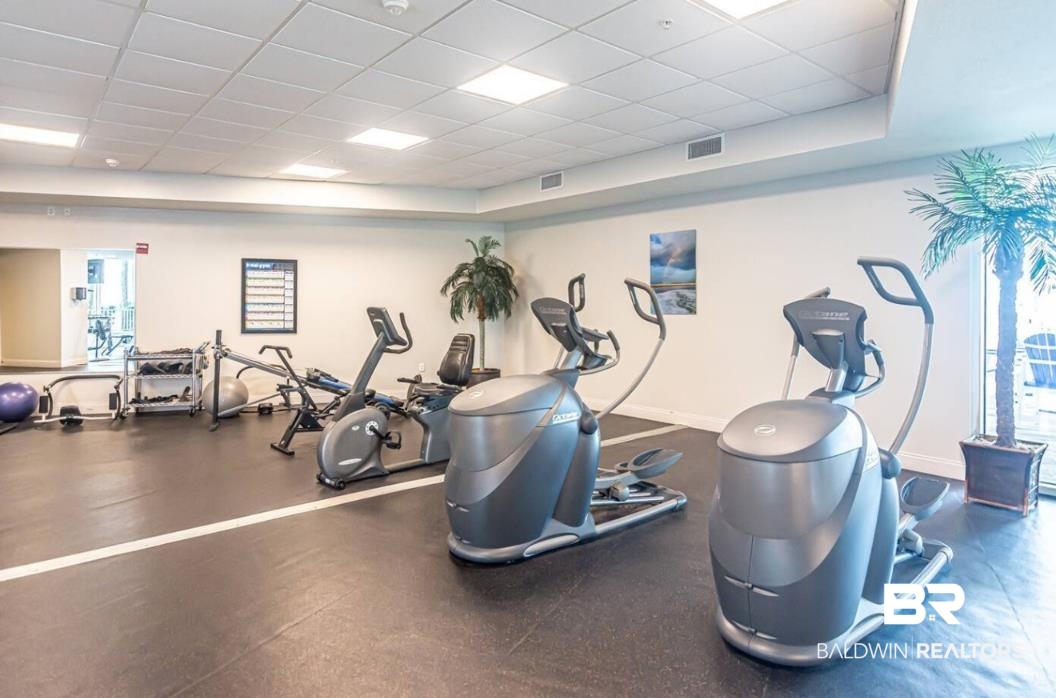 27800 Canal Road, Unit 212 Orange Beach, AL 36561 - Photo 40 of 43 Gym with visible vents, baseboards, and a paneled ceiling