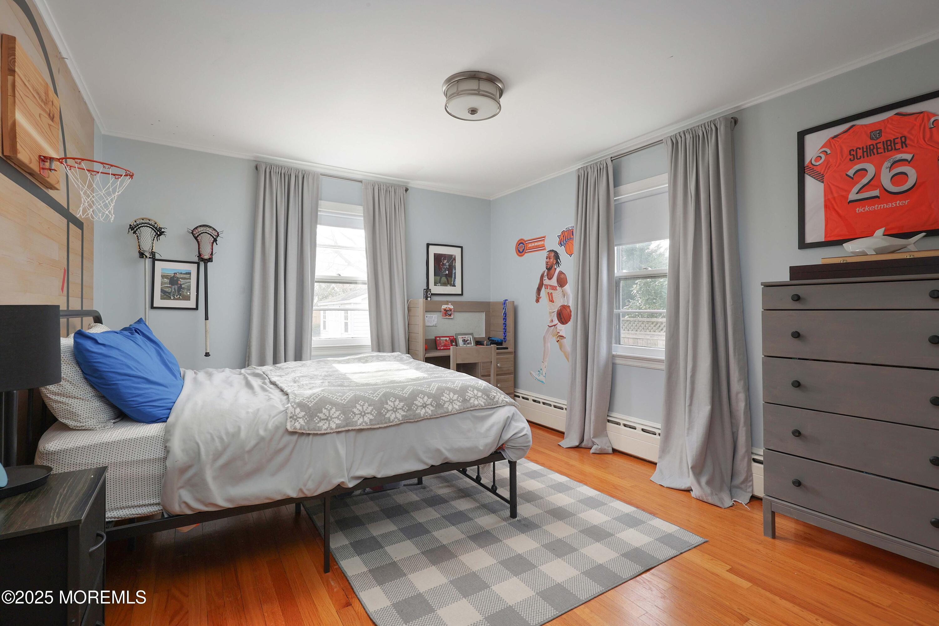 29 SilverWhite Road Little Silver, NJ 07739 - Photo 16 of 38 a bedroom with a bed and wooden floor