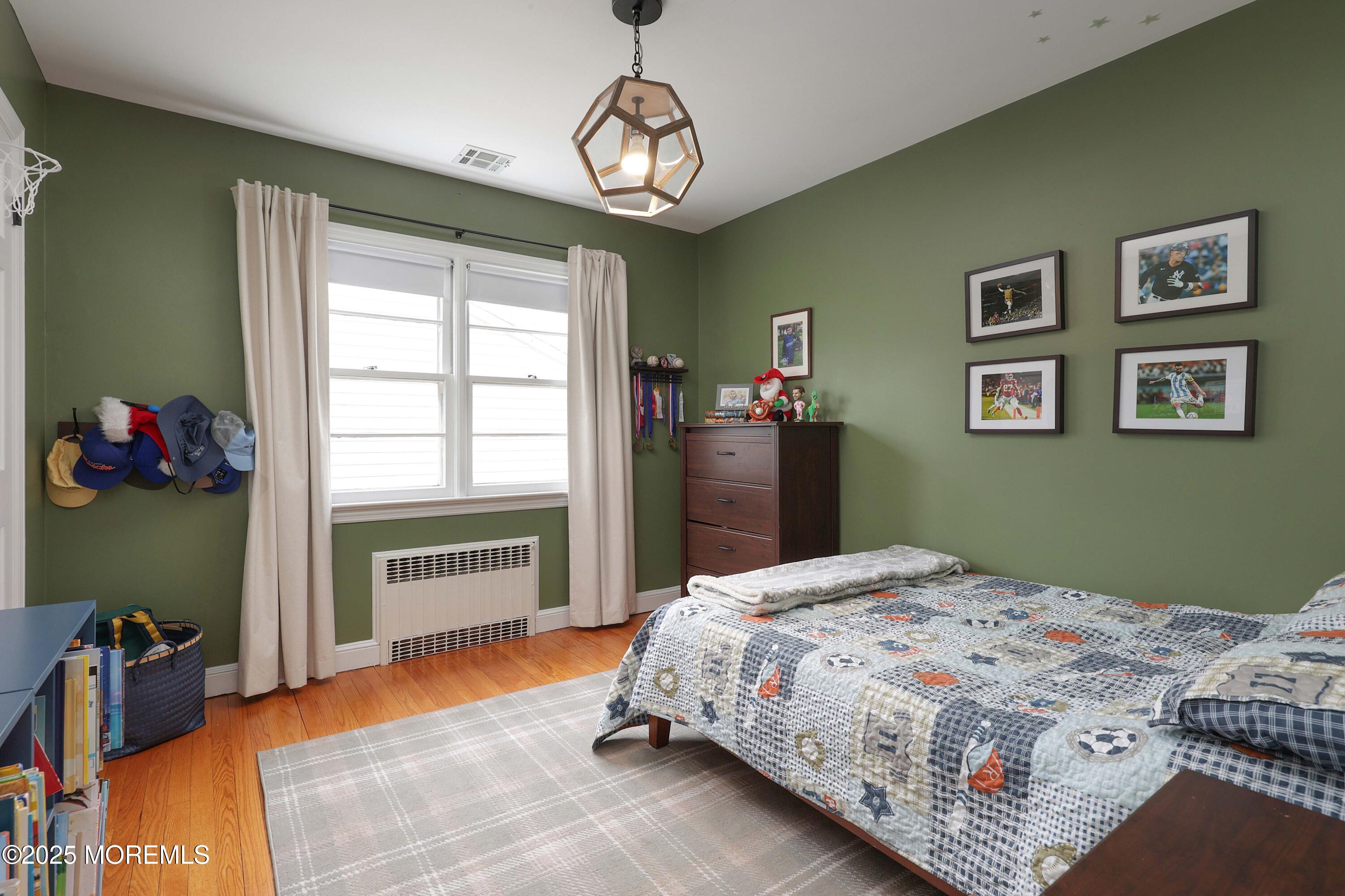 29 SilverWhite Road Little Silver, NJ 07739 - Photo 17 of 38 a bedroom with a bed and a window