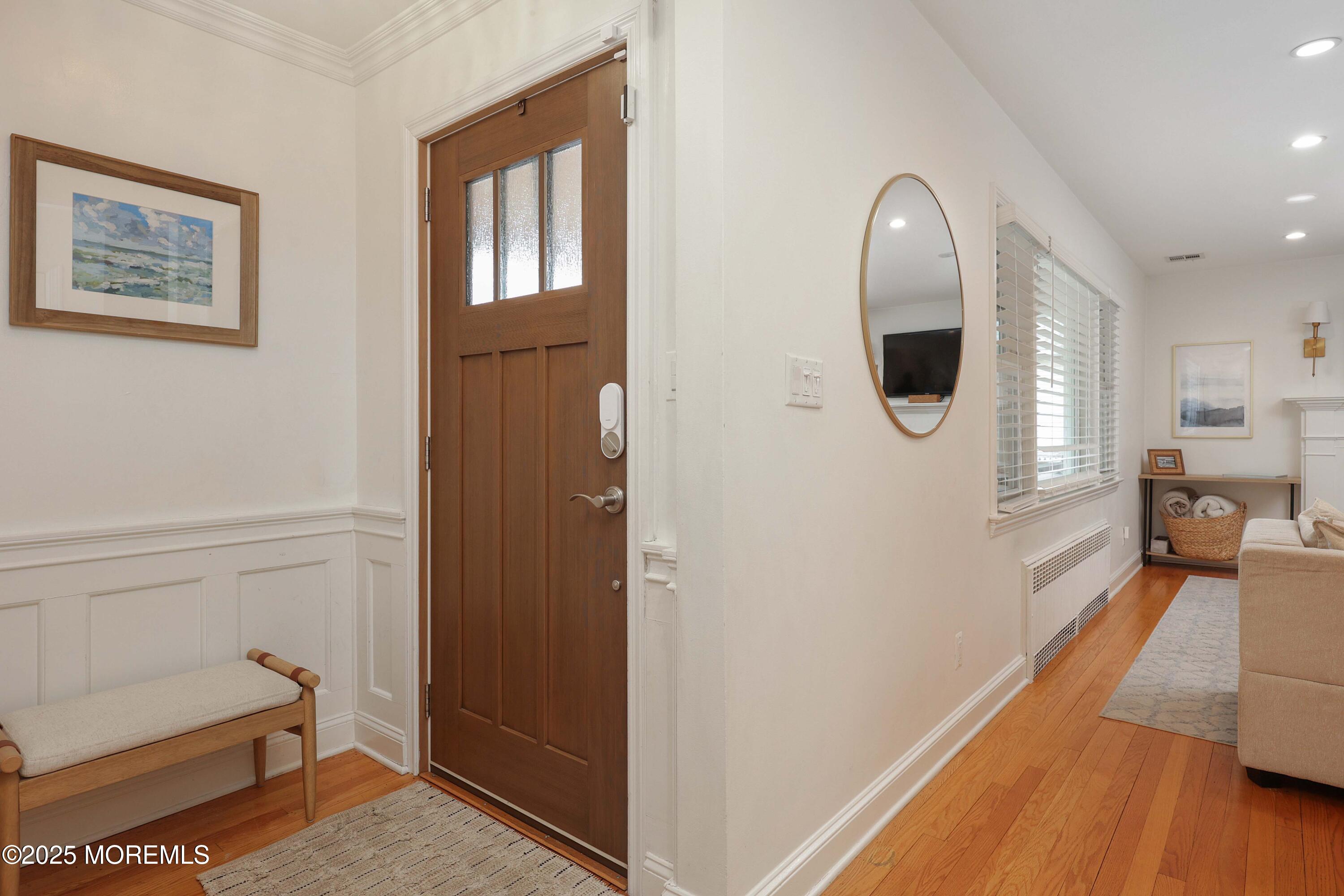 29 SilverWhite Road Little Silver, NJ 07739 - Photo 2 of 38 a view of a hallway with bathroom and wooden floor