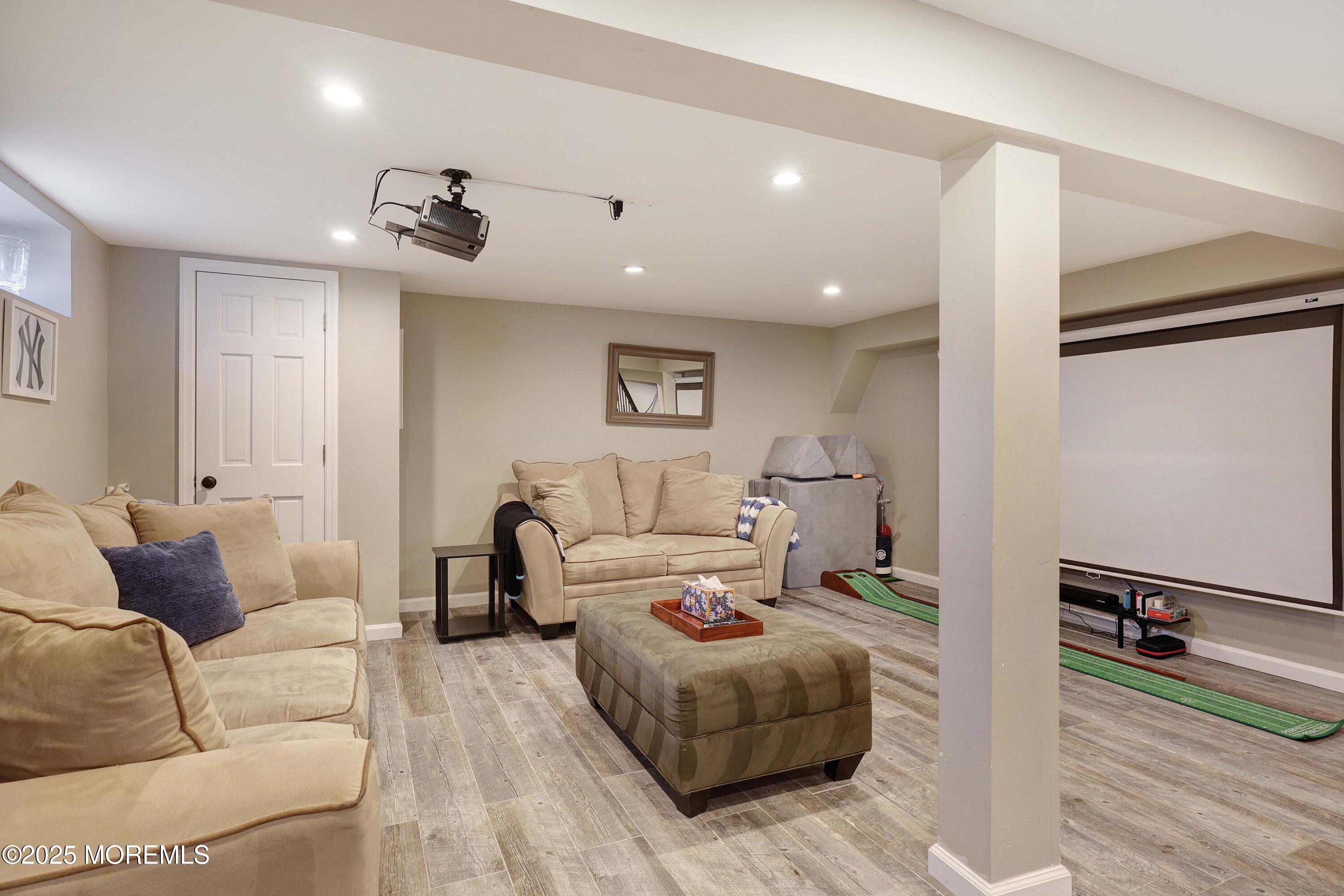 29 SilverWhite Road Little Silver, NJ 07739 - Photo 25 of 38 a living room with furniture and a wooden floor