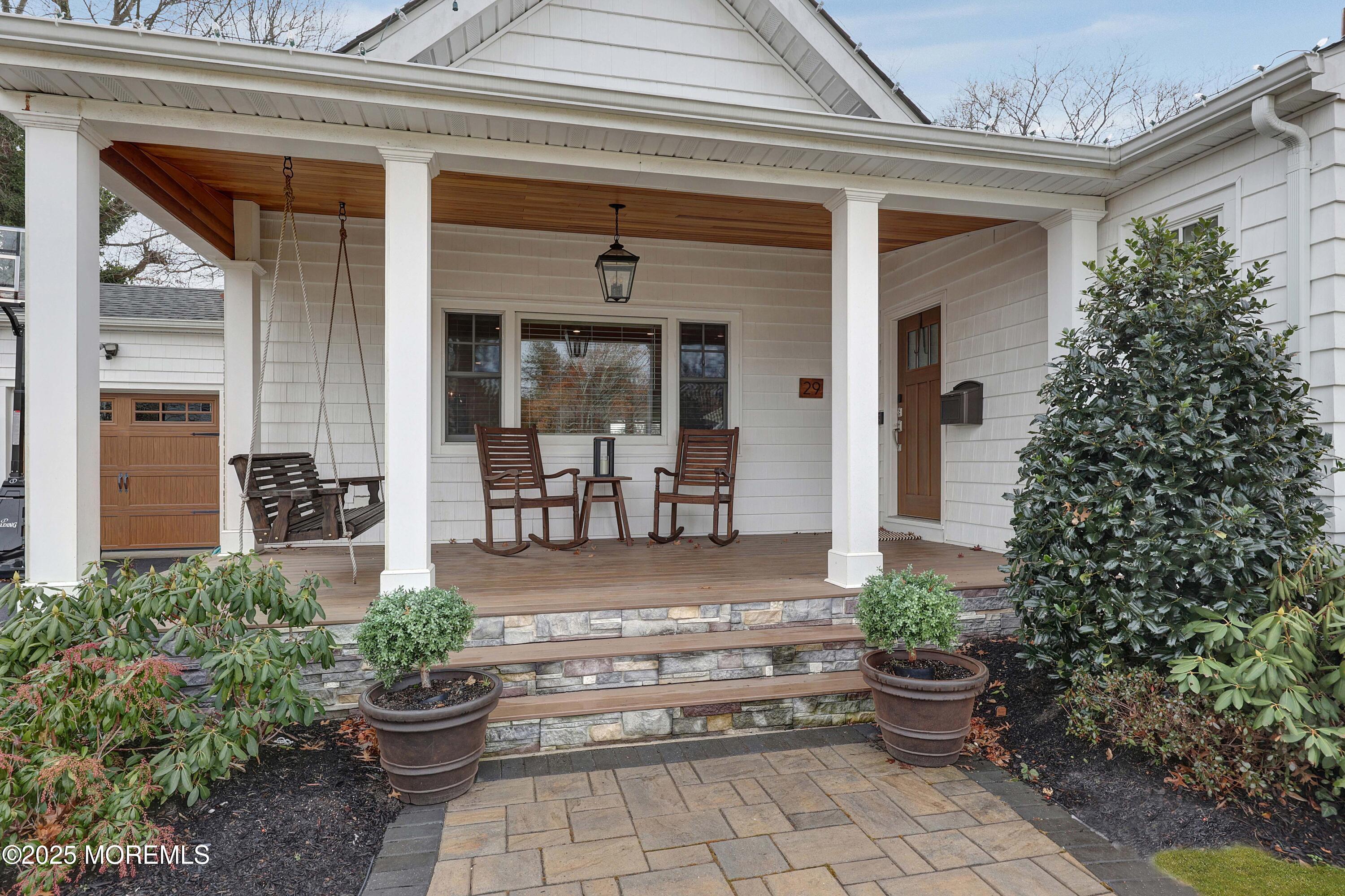 29 SilverWhite Road Little Silver, NJ 07739 - Photo 26 of 38 front view of a house with potted plants