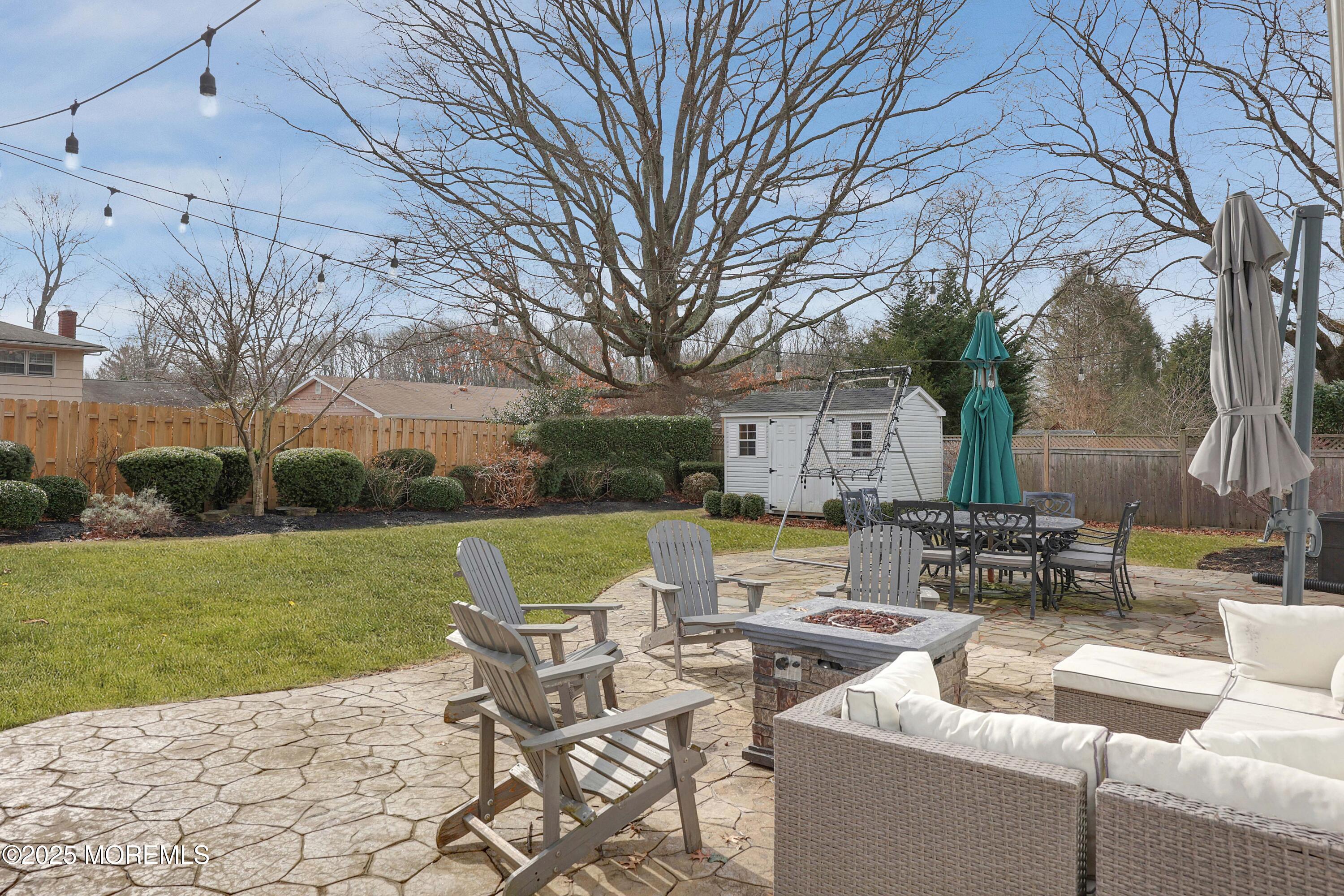 29 SilverWhite Road Little Silver, NJ 07739 - Photo 32 of 38 a view of a house with backyard sitting area and garden