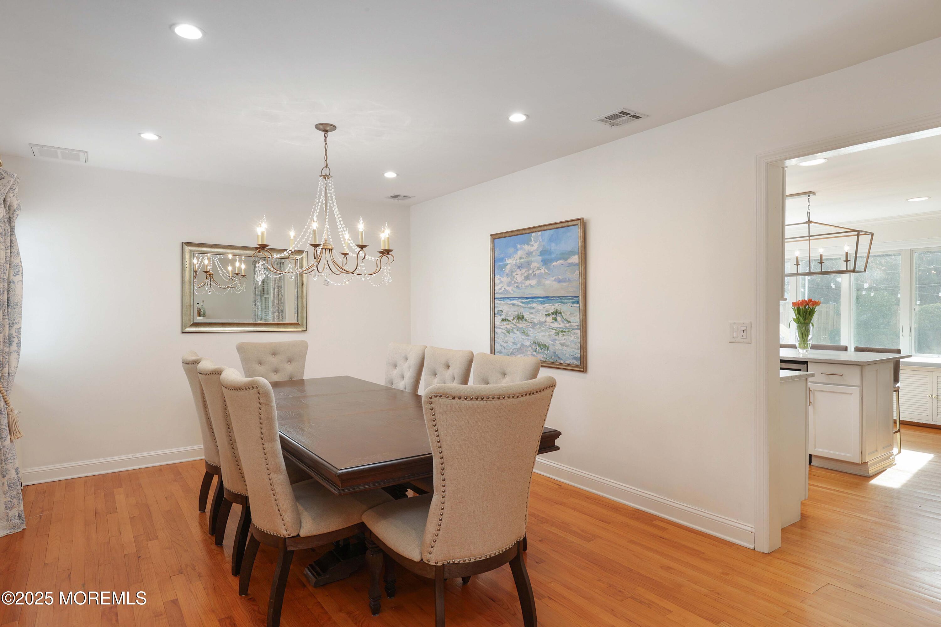 29 SilverWhite Road Little Silver, NJ 07739 - Photo 7 of 38 a view of a dining room with furniture wooden floor and chandelier