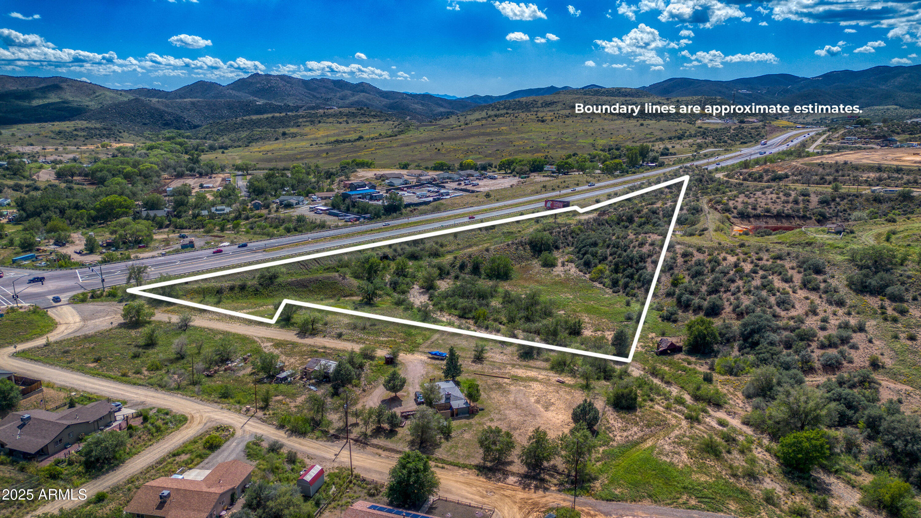 2862 Highway 69 Humboldt, AZ 86329 - Photo 5 of 15 a view of a yard in front of a house with a floor to ceiling window