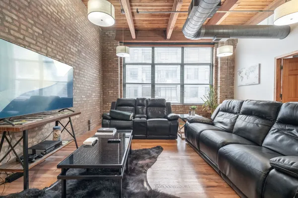 a workspace with furniture and wooden floor