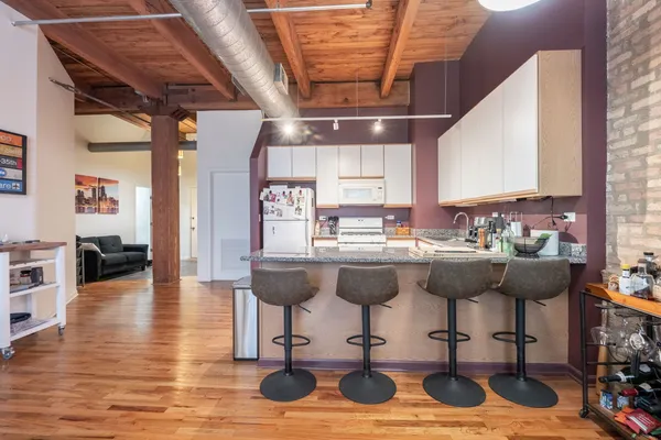 a kitchen with stainless steel appliances granite countertop a sink and cabinets