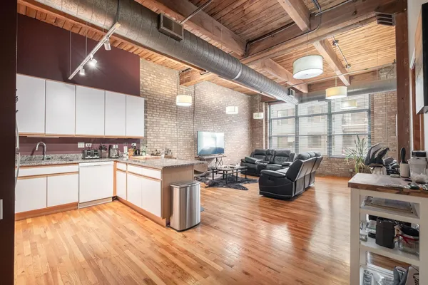 a living room with furniture a couch and a flat screen tv