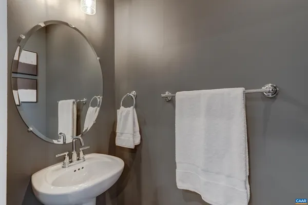 a bathroom with a sink and mirror