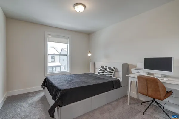 a bathroom with a double vanity sink toilet and a mirror