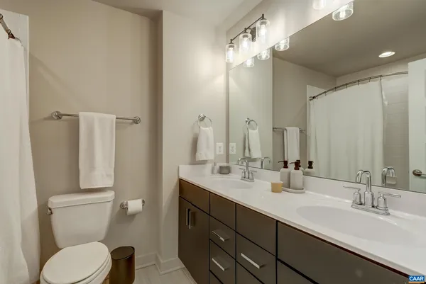 a bathroom with a shower and a toilet