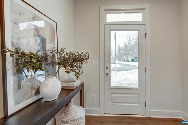 a kitchen with stainless steel appliances a sink stove and cabinets