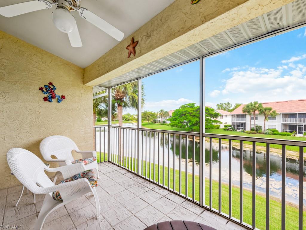 4970 Deerfield Way, Unit F202 Naples, FL 34110 - Photo 14 of 19 a view of a chairs in balcony