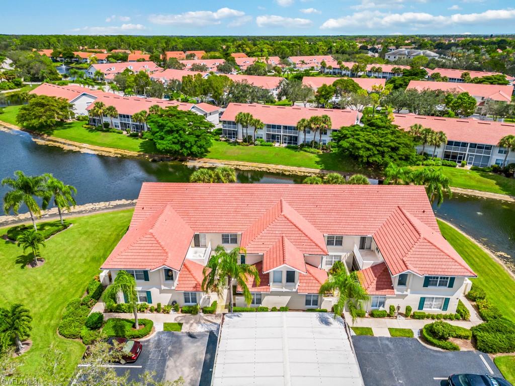 4970 Deerfield Way, Unit F202 Naples, FL 34110 - Photo 16 of 19 an aerial view of multiple house