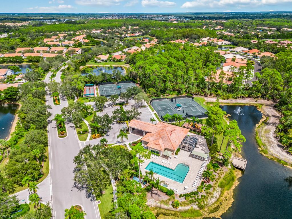 4970 Deerfield Way, Unit F202 Naples, FL 34110 - Photo 3 of 19 an aerial view of residential houses with outdoor space and street view