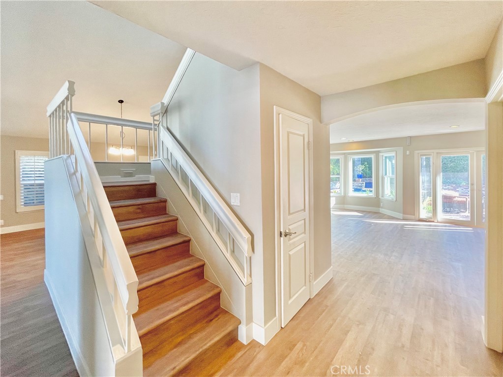 10 Ramada Irvine, CA 92620 - Photo 11 of 22 a view of a hallway with wooden floor and staircase